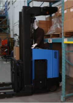 Figure 1 Reach truck. Note the lack of a protective structure behind the operator.